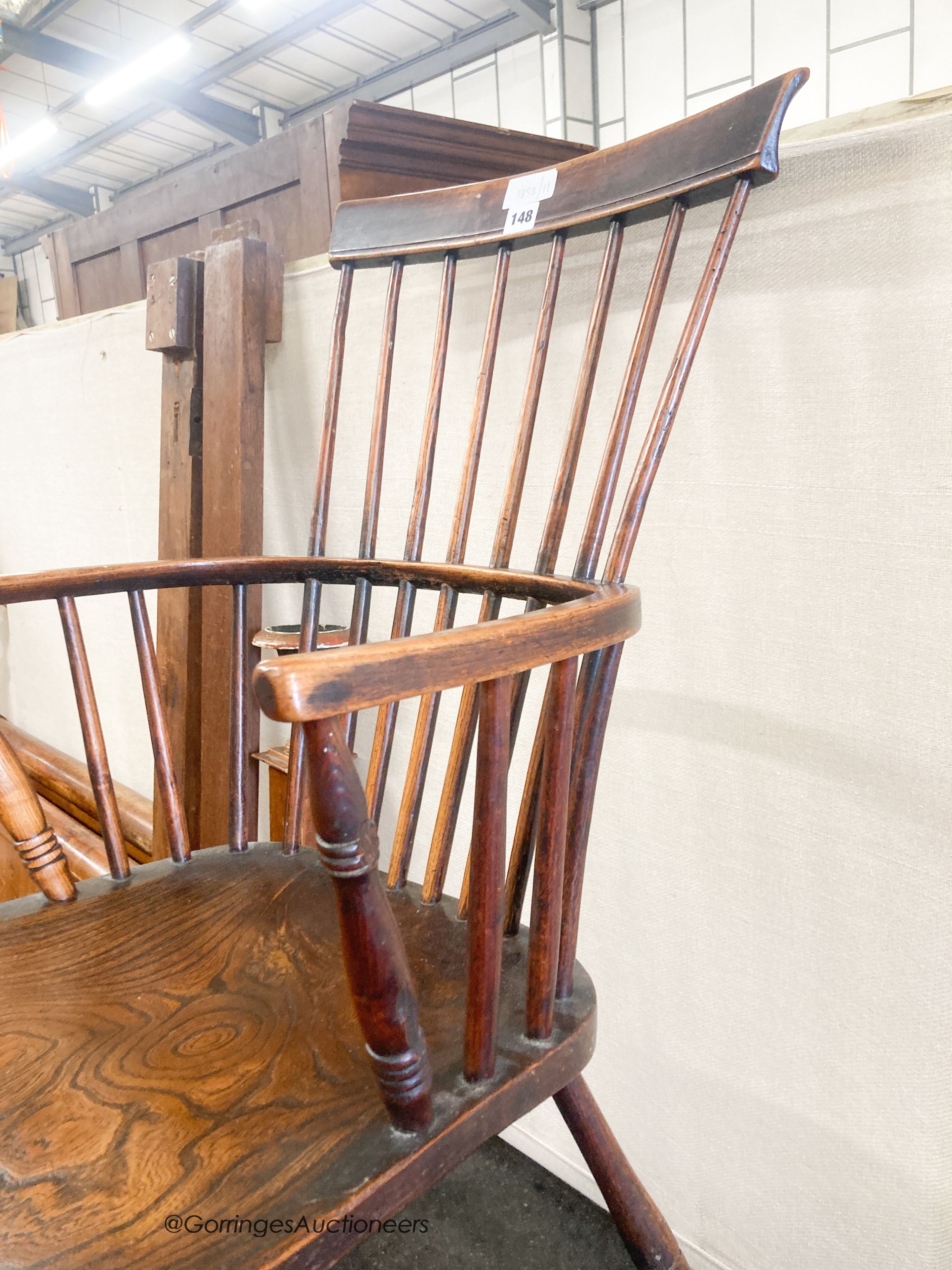 A 19th century elm and fruitwood Windsor comb back armchair, width 50cm, depth 40cm, height 96cm